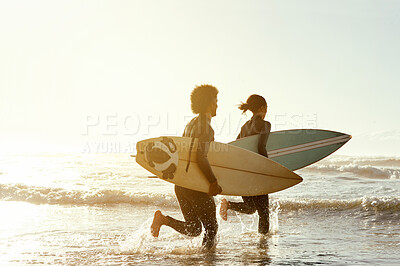 Buy stock photo Man, woman and surfing with running by sea for fitness, waves and training together in summer sunshine. Friends, surfboard and sunset workout with happiness, free and mockup space by ocean on holiday