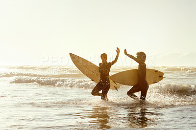Buy stock photo Surfing friends, high five and beach in water with celebration, congratulations and fitness achievement in sunset. Surfer man, woman and sports success on mockup in support for wellness goals by sea