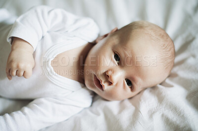 Buy stock photo Baby closeup, family home and young newborn portrait on a bedroom in the morning calm and relax. Healthy boy, child face and a house with a toddler ready for a nap, sleeping and rest on a blanket