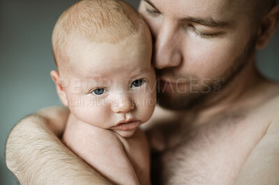 Buy stock photo Family, baby and dad with a parent hugging his child in studio on a gray background for tender or gentle love. Babies, father and children with a man holding his newborn infant while bonding together