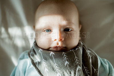 Buy stock photo Baby, face and portrait with cute child in nursery, relax with growth and early childhood development. Sunshine, morning and little kid at family home, calm adorable infant in bed and above