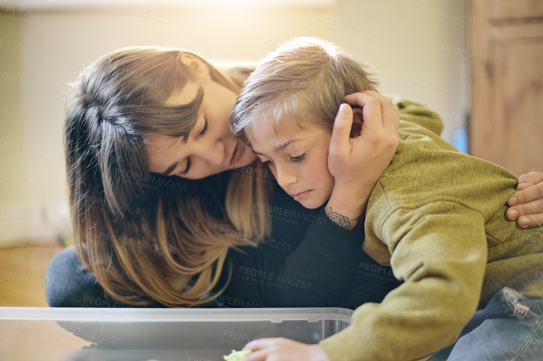 Buy stock photo Love, bond and mother hugging with her child while playing together in his bedroom with toys. Happy, cute and young woman embracing her boy kid with gentle, comfort and care at their family home.