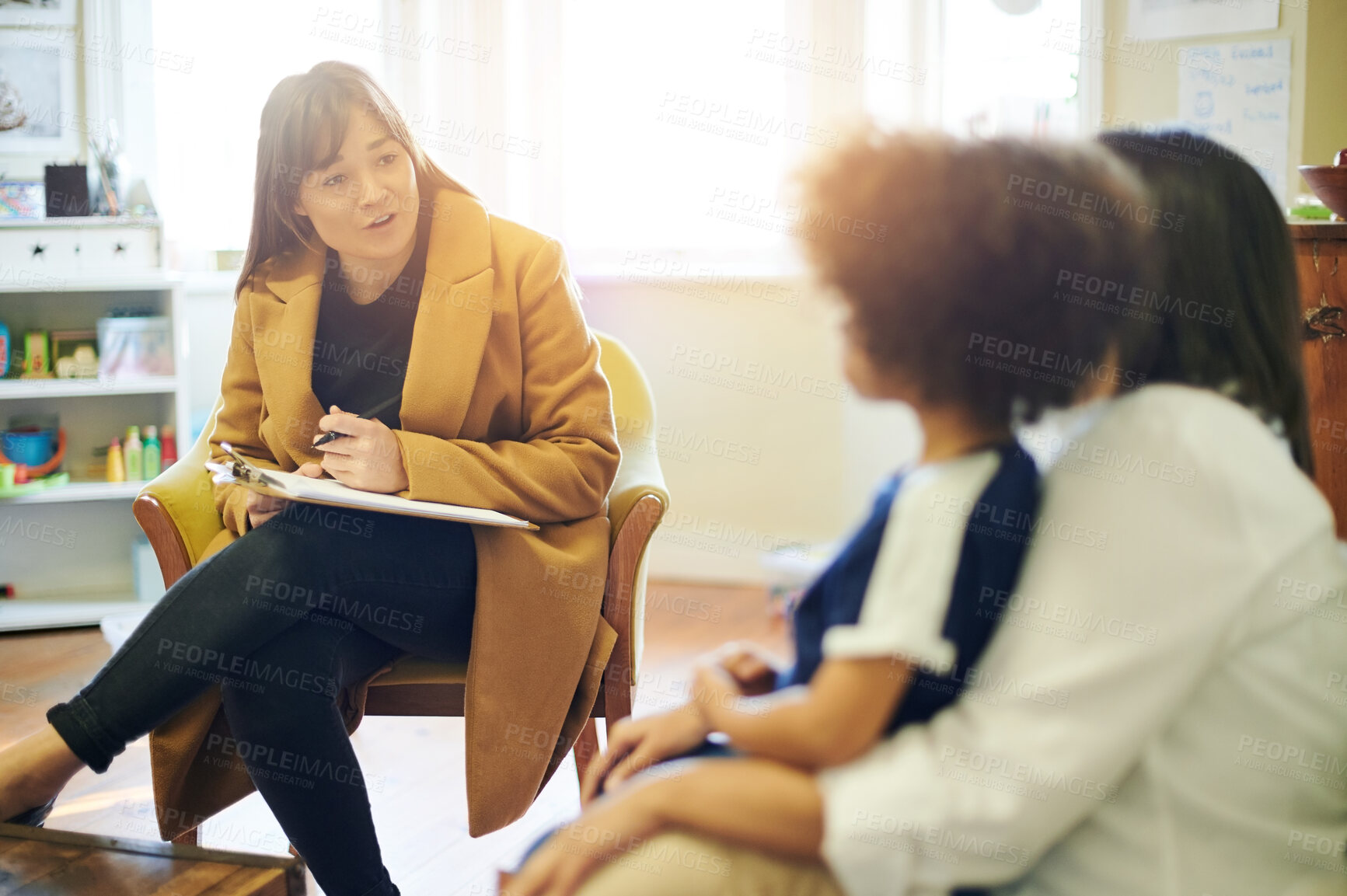 Buy stock photo Support, talking and a therapist with a child and parent for discussion about education. Help, therapy and therapist speaking to a kid and mom about helping with mental health and learning disability