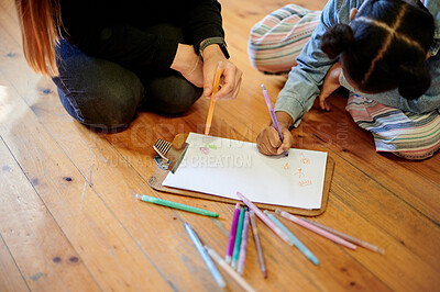 Buy stock photo Creative, drawing and art with kid and teacher on floor of classroom for learning, education and teaching. Color, sketching and child development with young girl and woman at school for picture