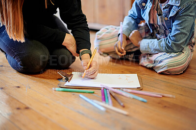 Buy stock photo Creative, color and art with kid and teacher on floor of classroom for learning, education and teaching. Drawing, sketching and child development with hands of girl and woman at school for picture