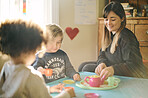 Mother, kids and play tea party in home, having fun and bonding together. Relax, children and drinking from toy cup with mama playing game with boys for imagination, childhood or pretending in house.