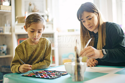 Buy stock photo Painting, learning and art with teacher and child in classroom for creative, education and youth. Teaching, hobby and drawing with woman and young boy for picture, inspiration and artwork lesson