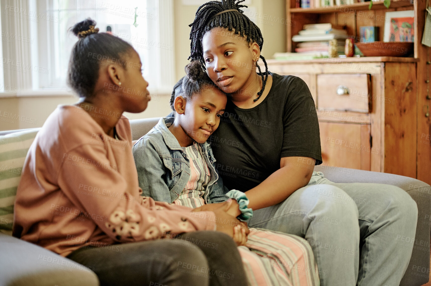 Buy stock photo Love, comfort and children with mother on a sofa holding hands, hug and sharing compassion in their home. Family, support and mom with unhappy kids in living room for help, understanding and empathy