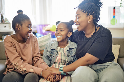 Buy stock photo Happy, hand holding and smile with mother and daughter on sofa for bonding, free time and weekend. Black family, affectionate and unity with woman and girls at home for joyful, carefree or support