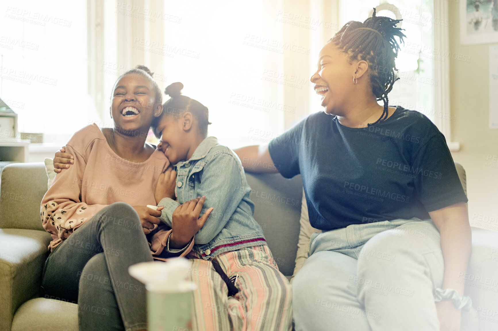 Buy stock photo Happy, laughing and smile with mother and daughters on sofa for bonding, free time and weekend. Black family, affectionate and funny with woman and young girls at home for joyful, carefree or support