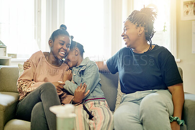 Buy stock photo Happy, laughing and smile with mother and daughter on sofa for bonding, free time and weekend. Black family, affectionate and funny with woman and young girls at home for joyful, carefree and support