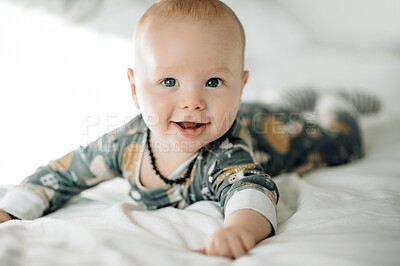 Buy stock photo Happy baby, portrait and face with cute child in nursery, relax with growth and early childhood development. Smile, little kid and adorable newborn with infant lying on bed in family home