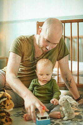 Buy stock photo Learning, playing and child care, man and baby on nursery floor, new dad and infant bonding with toys in playroom. Family, love and young father with small kid in bedroom with development toy at home