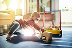 Childhood, game and a baby with toys for playtime, educational games and nursery play. Kindergarten, young and a playful toddler playing with a toy in a playroom for mental development in a lounge