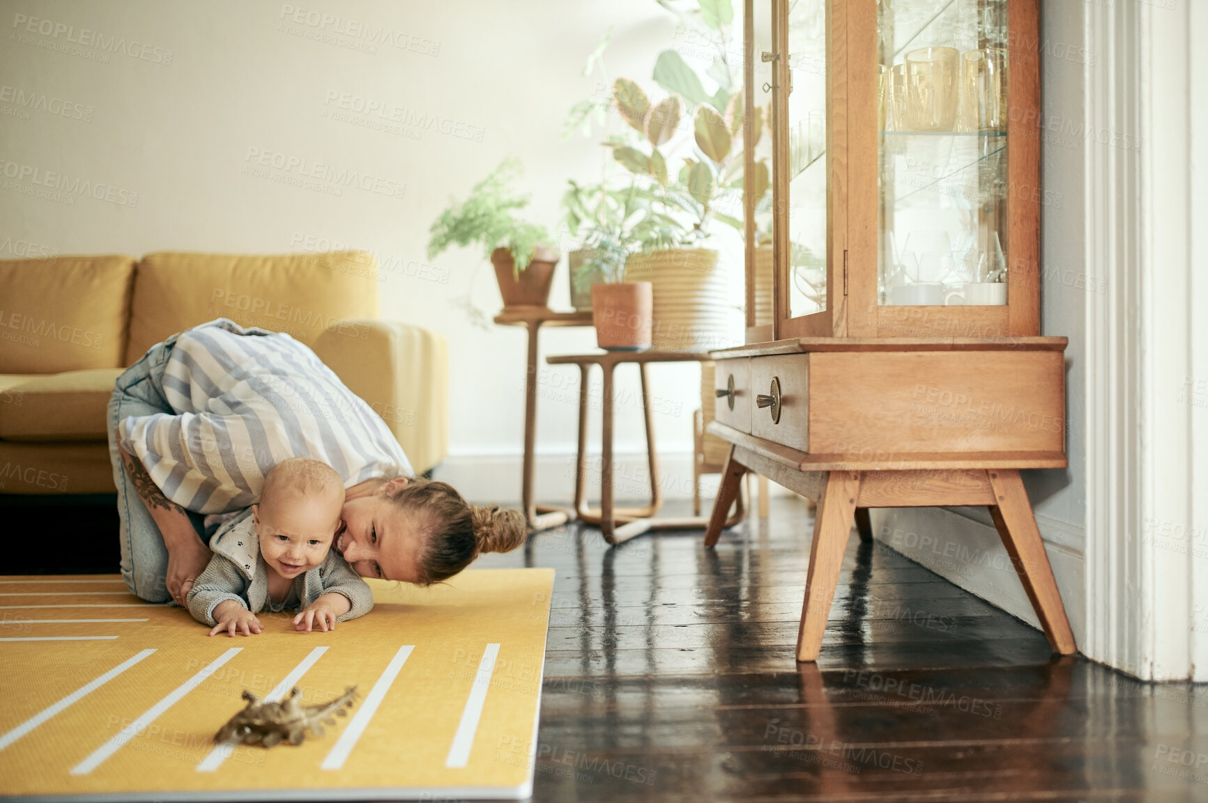 Buy stock photo Baby, child development and mother playing with infant on the floor of a house or home and bonding together. Care, motherhood and single parent or woman having fun with newborn kid with happiness