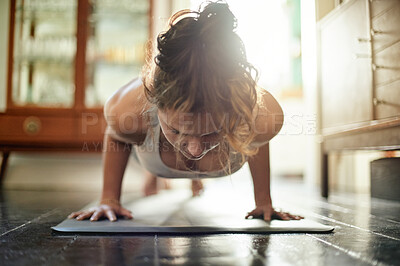 Buy stock photo Push up, exercise and woman with balance, training and workout for wellness, healthy lifestyle and cardio. Female, lady and athlete in living room, body care and practice for energy, calm and power