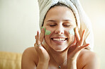 Beauty, smile and woman applying facial mask product on her face for skincare and self care in her home or house. Detox, treatment and female cleaning her skin for morning routine while she relax