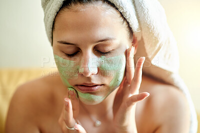 Buy stock photo Facial, treatment and woman using cosmetic product on her face for beauty, skincare and self care in her home or house. Detox, mask and female cleaning her skin for morning routine while she relax
