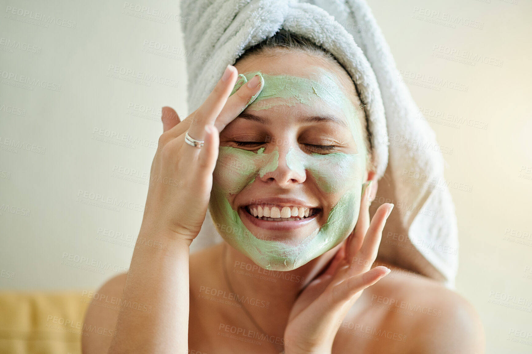 Buy stock photo Face, treatment and woman applying facial product for beauty, skincare and self care in her home or house. Detox, mask and happy female cleaning her skin for morning routine while she relax and smile