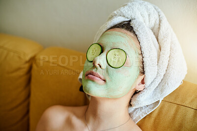 Buy stock photo Face, treatment and woman with cucumber on eyes doing a facial for vitamin c, wellness and natural beauty lying on a couch or sofa. Relax, spa and skincare of female using healthy vegetable to detox