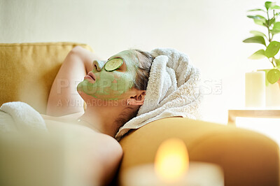 Buy stock photo Facial, relax and woman with cucumber on eyes or face for vitamin c, wellness and natural beauty lying on a couch or sofa. Dermatology, spa and skincare of happy female using vegetable to detox