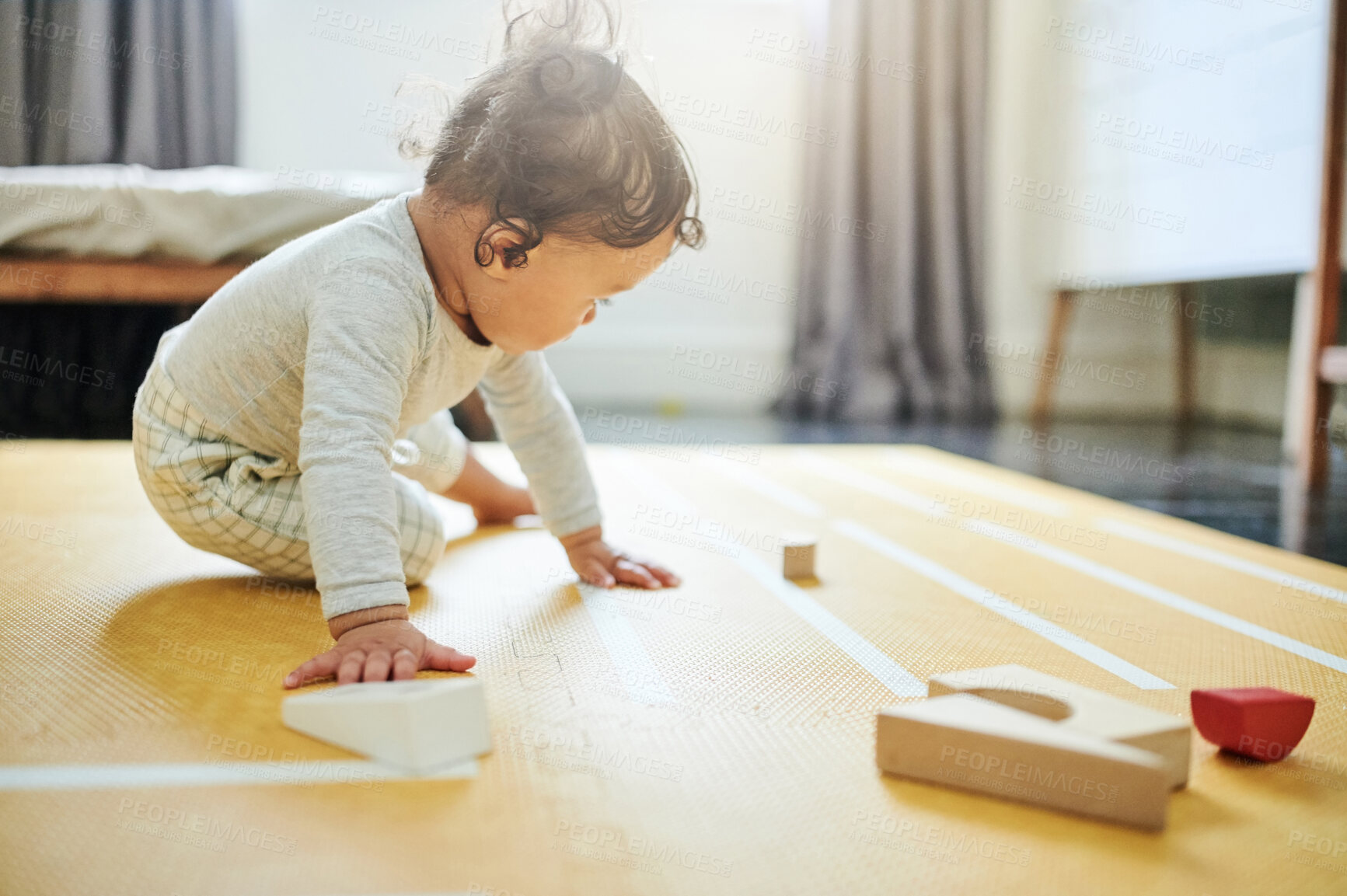 Buy stock photo Boy kid, blocks and playing on floor in home, childhood growth and fun development. Baby, educational wooden toys and games for montessori learning, creative puzzle and motor skills in nursery room