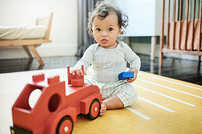 Buy stock photo Toy truck, baby play and portrait in home, having fun and relaxing in house nursery. Development, childhood and playful and cute child, infant or newborn playing with toys, red car and learning.