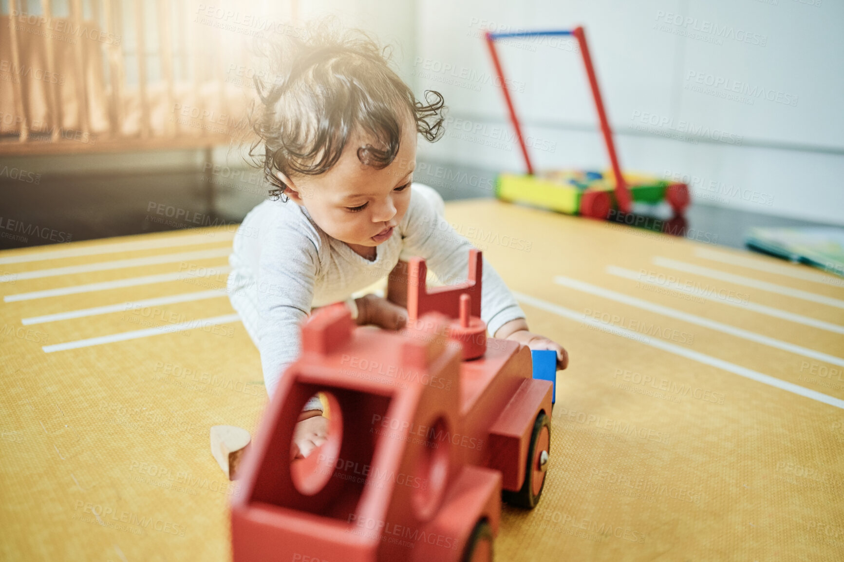 Buy stock photo Baby, boy and wooden car toys on floor in nursery, childhood growth or creative development. Kids truck, playing and games for education, montessori learning or cognitive coordination of motor skills