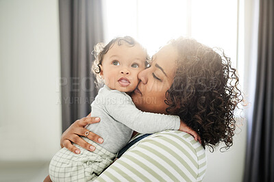 Buy stock photo Love, mother and kiss baby in home, bonding and care, affection and support. Development, childhood and mama kissing foster kid, carrying toddler or newborn, hugging and embrace together in house.