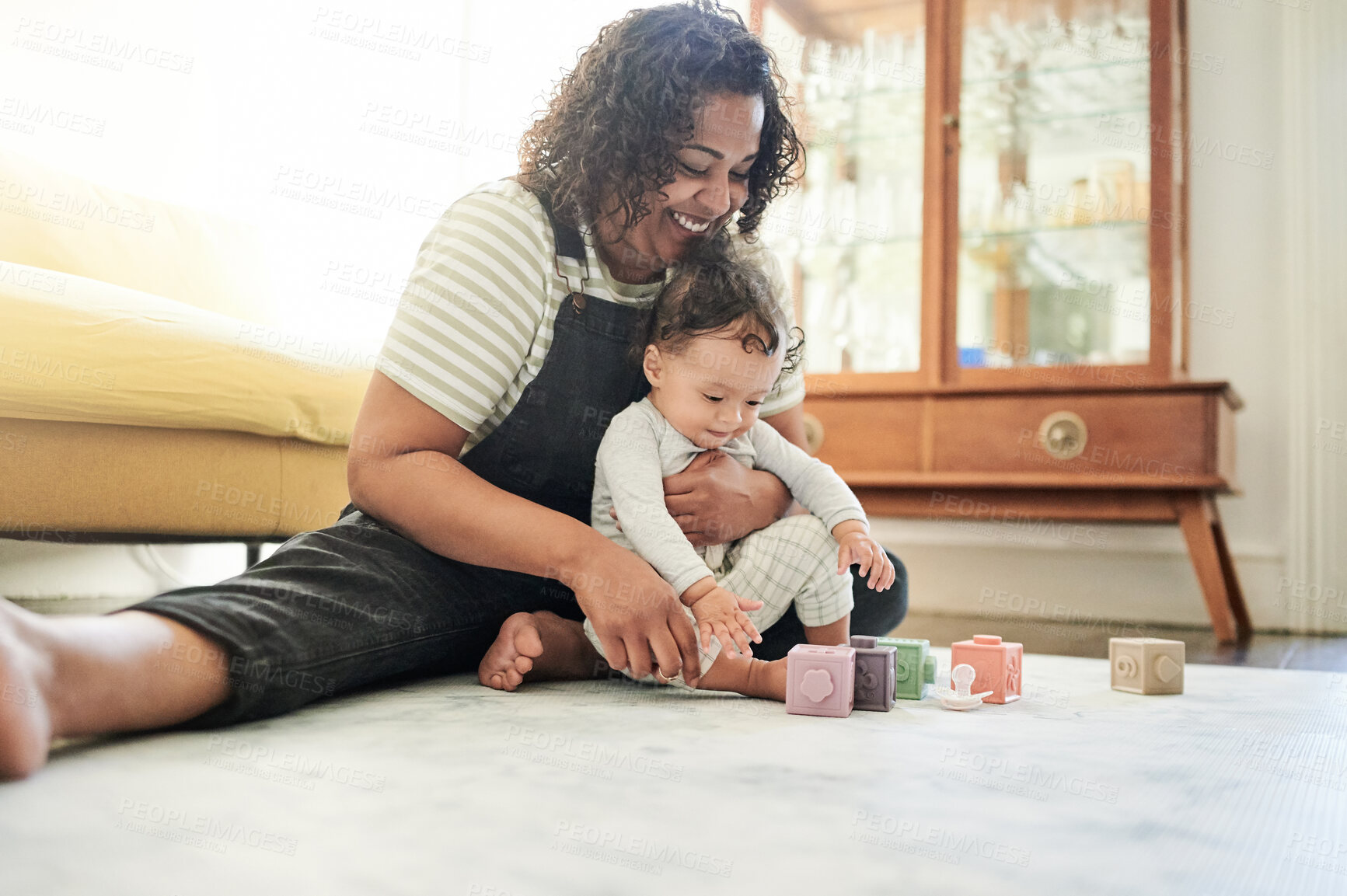 Buy stock photo Mother, baby and play with toy blocks in home, learning and education in house. Development, care and happy mama playing with child toys, newborn or toddler while bonding and having fun together.