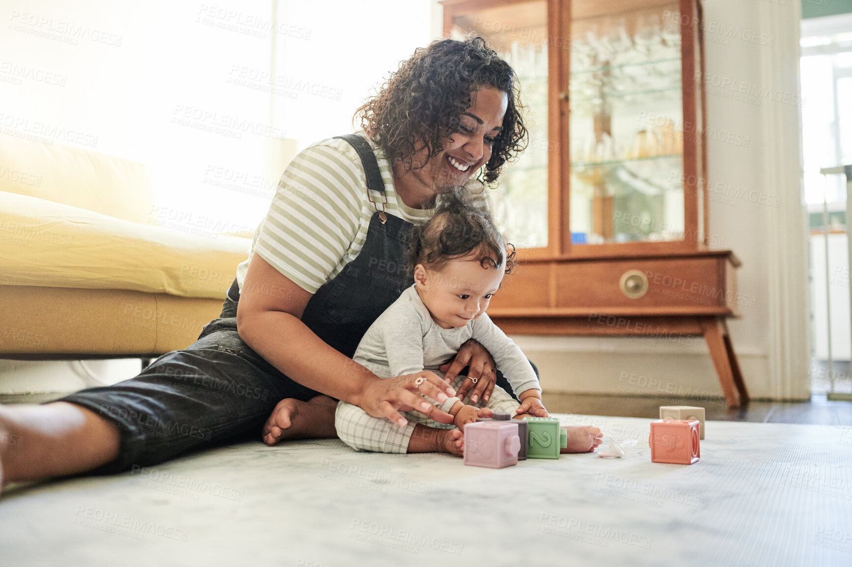 Buy stock photo Mother, baby and play with toy blocks in home, learning and education in house. Development, care and happy mama playing with child, number toys and newborn while bonding and having fun together.