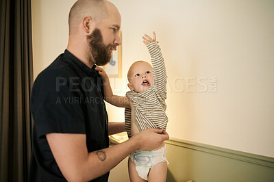 Buy stock photo Children, clothes and a father changing his baby in pajamas in the nursery of their home for bedtime. Family, kids and a young male parent dressing his infant boy child in clothing in the house