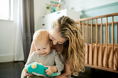 Buy stock photo Relax, mother and baby on the floor, toy and bonding for development, support and loving at home. Family, parent and mama with kid, child or happy toddler on ground, growth or playing games on break