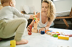 Mother, child and playing with baby toys or learning blocks in a family home bedroom for fun. Woman or mom with toddler child together for quality time, happiness and building or growth development