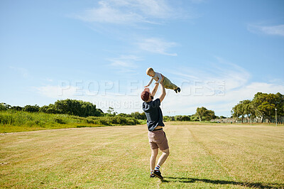 Buy stock photo Park, happy and baby play with father in field for bonding, quality time and adventure in countryside. Family, love and dad with boy in air outdoors on holiday, summer vacation and weekend in nature
