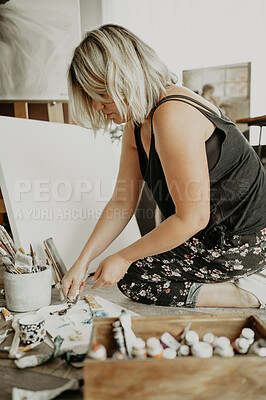 Buy stock photo Home, creative and woman with art, painting and color paint with canvas, ideas and design in workshop. Female person, artist or lady in studio, house and squeezing tube with talent, goals and startup