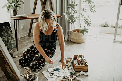 Buy stock photo Artist, painting and canvas with woman on floor at apartment with creativity for passion. Colour, brush and art with female person at studio for project with oil paint for work with talent for craft.