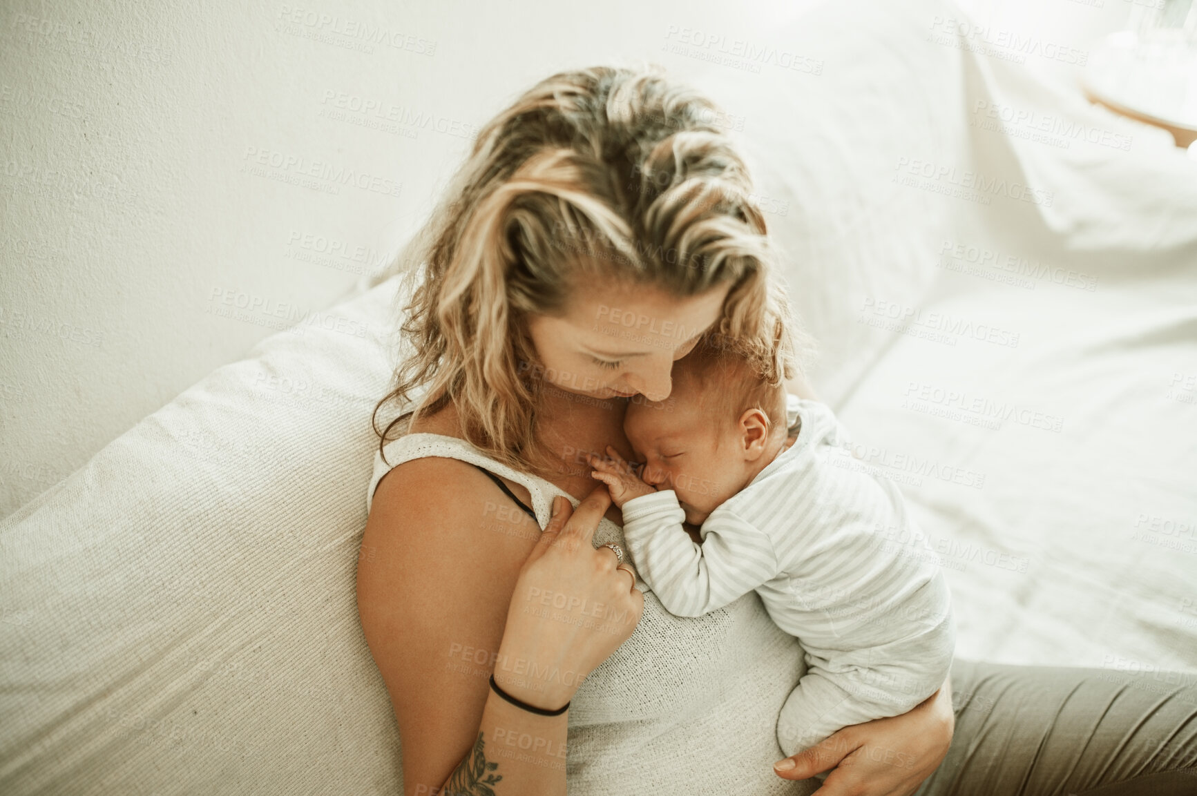 Buy stock photo Mother, baby sleeping and living room in a home with parent care, love and hug on a sofa. Nap, mama and newborn child in a family house with mom and young kid together with youth on a lounge couch