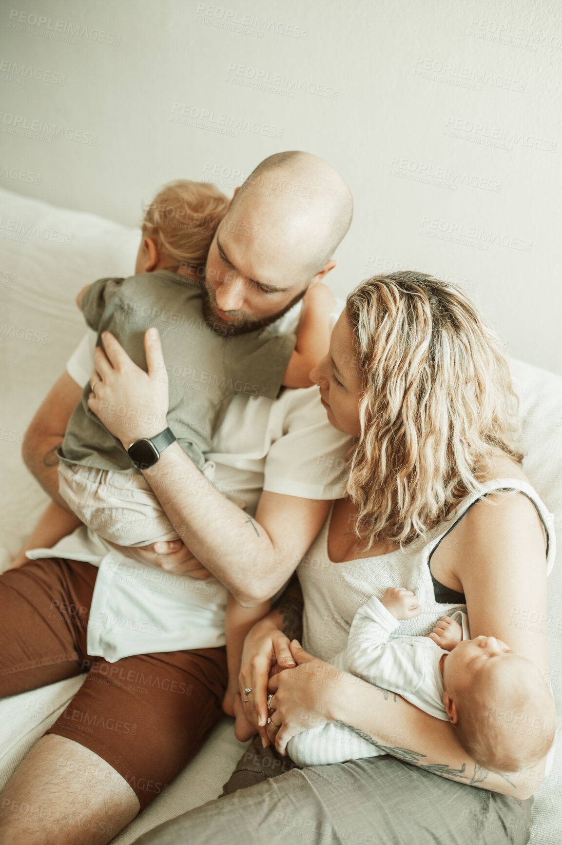 Buy stock photo Parents with sleeping children, bonding and love, man and woman with toddler and newborn, love and care in relationship. Childhood, parenting and people with kids on couch and family time together