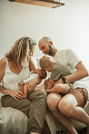 Parents, baby children and couch in home lounge with care, love and bond together to relax. Man, woman and kids with newborn, brothers and family house on living room couch for childhood development