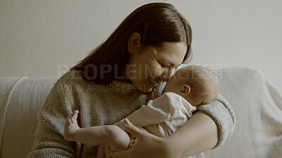 Buy stock photo Bond, love and mom with her newborn on a sofa for relaxing in living room of family home. Smile, care and young mother holding her infant, baby or child with happiness in lounge for resting in house.