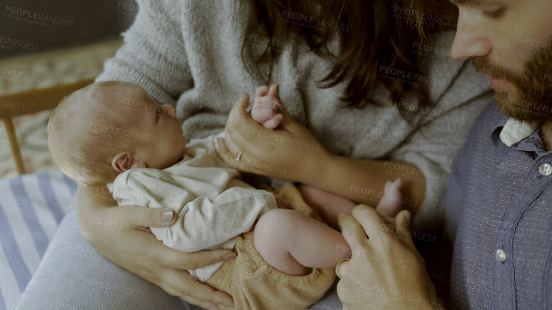 Buy stock photo Hands, mother or father with baby in a family to relax or bond together for care or child development. Hug, parents closeup or proud dad with mom or newborn infant for support, trust or love at home