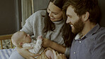Parents, newborn and happy couple with child for love, care or bonding in a home as fun or affection together. Happiness, dad and mother relax in living room with infant kid as family in house
