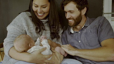 Buy stock photo Mother, father and baby on a sofa to relax in the living room of their home together for love, care or bonding. Family, smile or happy with parents holding their cute newborn infant chid in a house