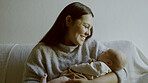 Mother, love and newborn bonding in arms for care and relax on sofa in lounge of family home with smile. Happiness, woman and baby sleeping for development and growth on couch in living room of house