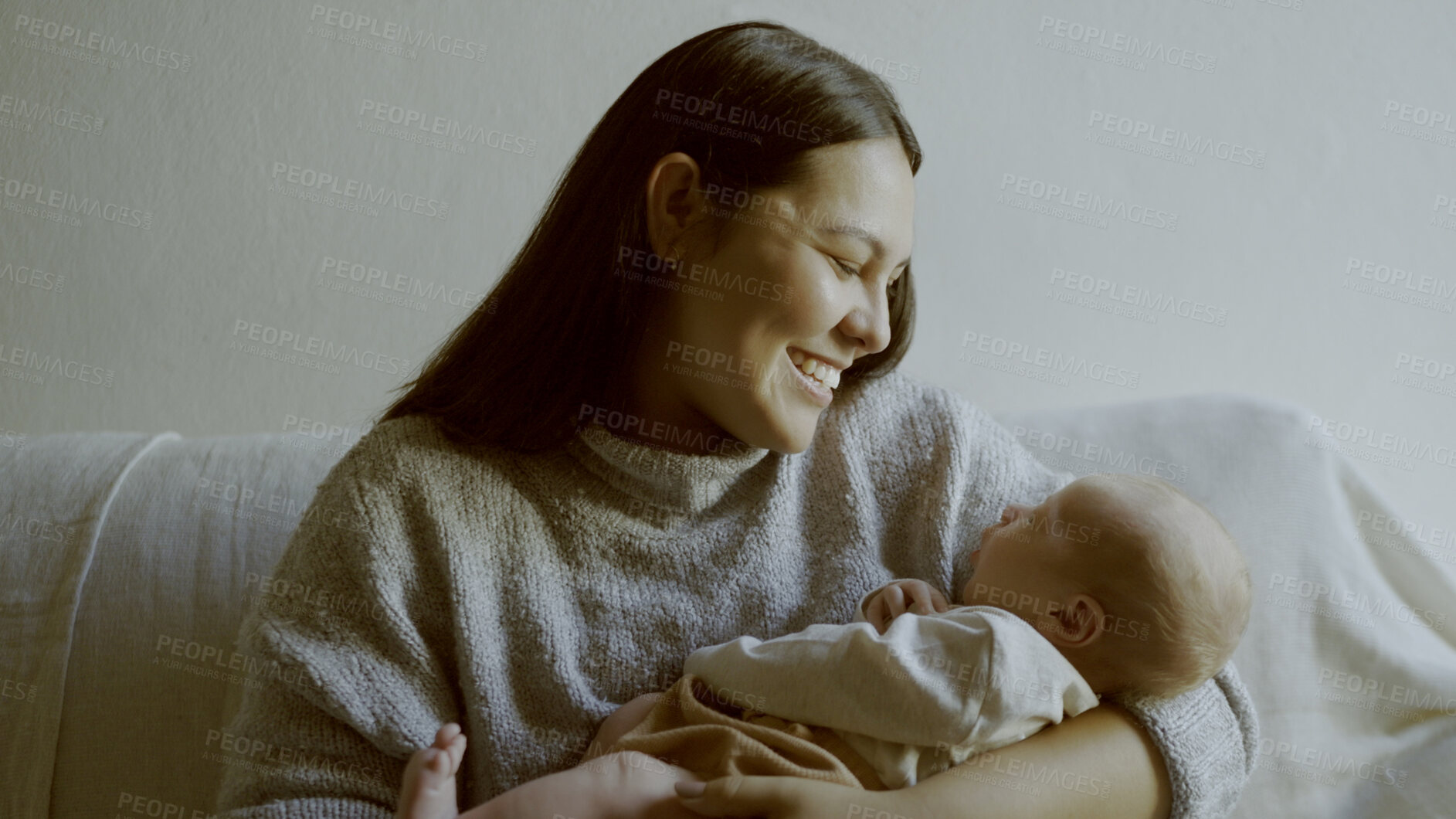 Buy stock photo Mother, love and newborn bonding in arms for care and relax on sofa in lounge of family home with smile. Happiness, woman and baby sleeping for development and growth on couch in living room of house