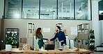 Man, woman and handshake in warehouse with boxes, deal and b2b agreement with teamwork for logistics. People, shaking hands and inventory with welcome, collaboration and packaging for supply chain