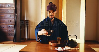 Buy stock photo Man, relax and tea ceremony in Japan for tradition, culture and matcha in home with preparation. Male person, ritual and bowl for mindfulness, zen and buddhism with spiritual, respect and harmony