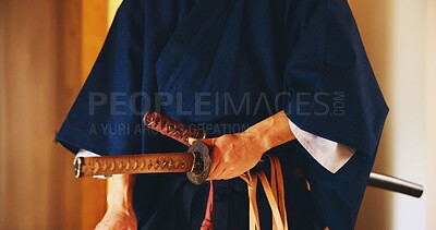 Buy stock photo Japan, martial arts and hands of samurai with sword for self defense, combat or protection in battle. Sensei closeup, person and weapon in sheath for routine practice, cultural discipline or kenjutsu