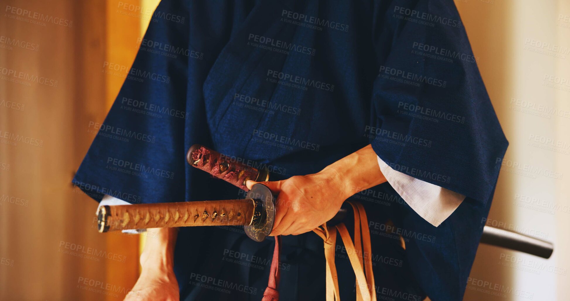 Buy stock photo Japan, martial arts and hands of samurai with sword for self defense, combat or protection in battle. Sensei closeup, person and weapon in sheath for routine practice, cultural discipline or kenjutsu